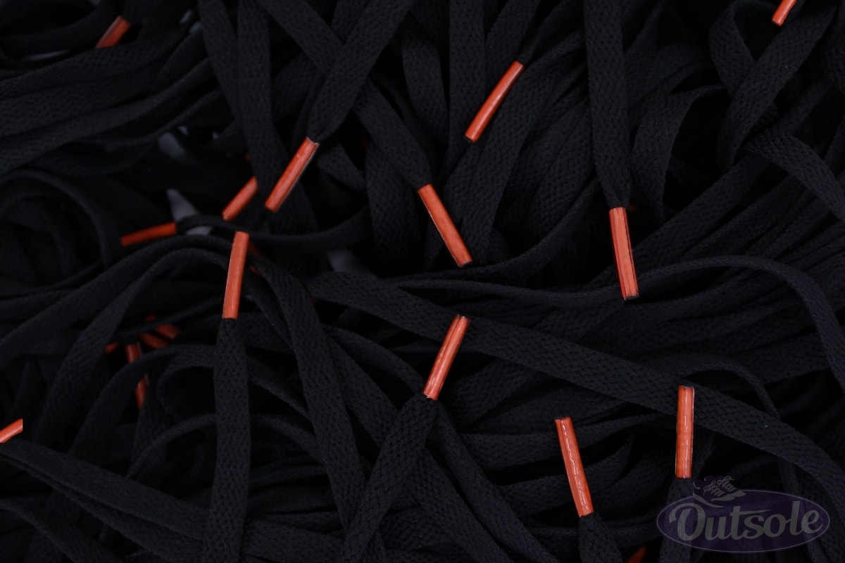 black nike shoes with orange laces
